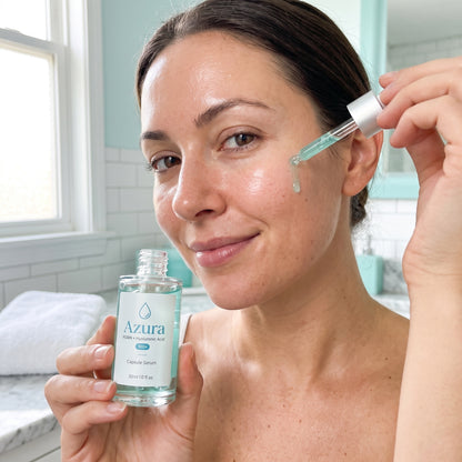 Woman applying Azura PDRN hyaluronic acid serum to her face