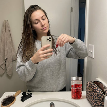 Woman using ArganGlow Hair Capsules