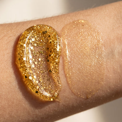 Close-up of the thick gold glitter gel texture on skin, beside an area where it has been massaged in to a golden sheen