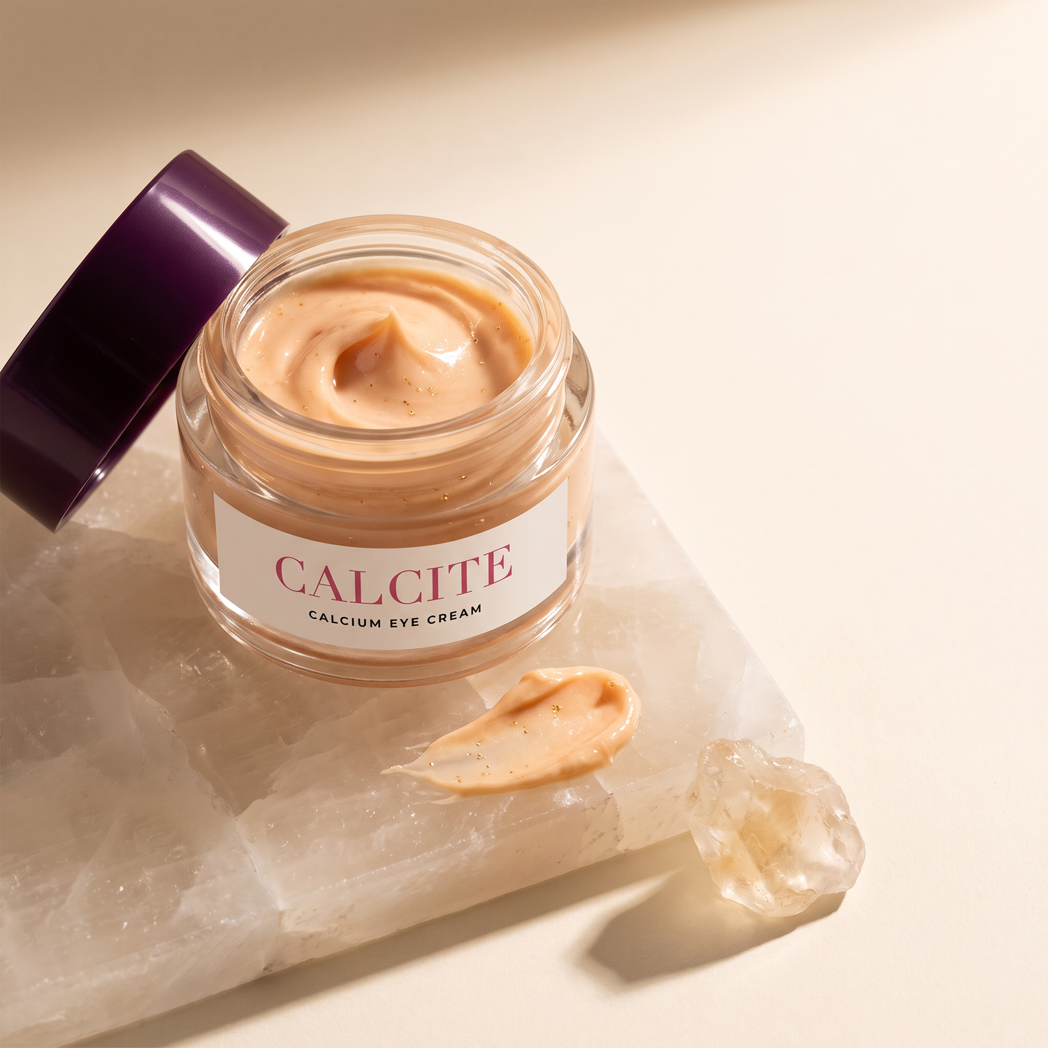 CALCITE jar open on a calcite slab, peach cream and swatch visible