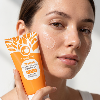 Close-up of woman applying PureZing exfoliating gel to her cheek with the tube in frame