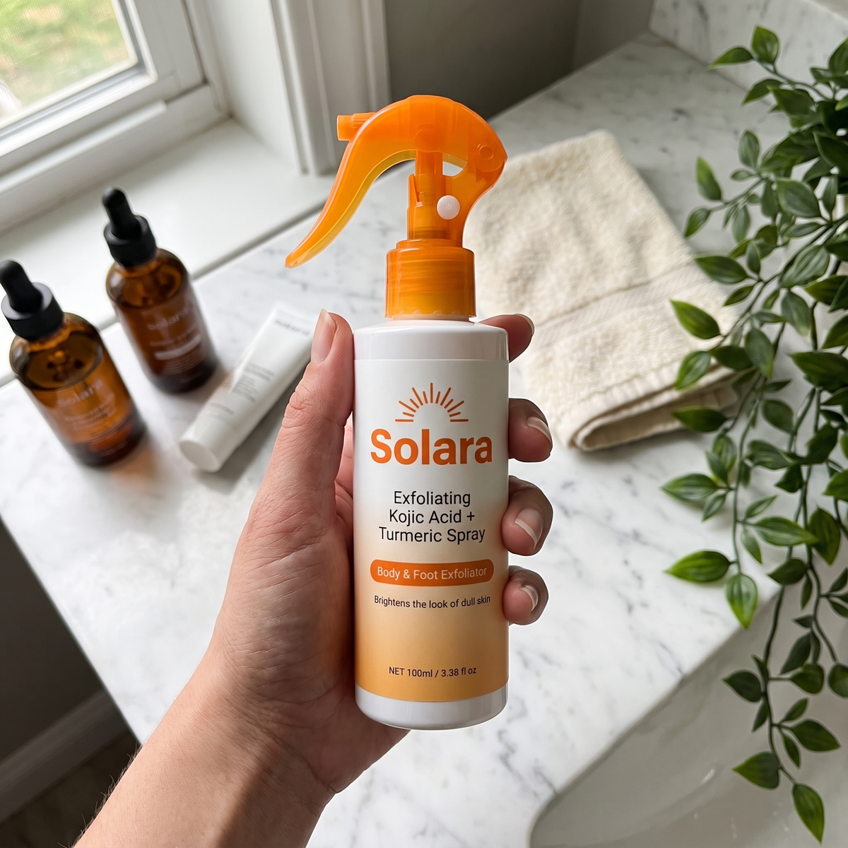 Solara body spray held above a marble bathroom vanity as part of a daily routine